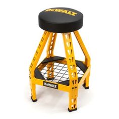 a yellow and black stool sitting on top of a white floor