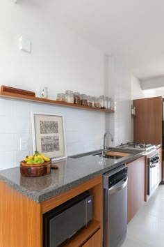 a kitchen with an oven, sink and dishwasher