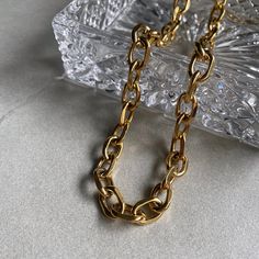 A trendy chunky link chain to elevate your stack. Chunky Link Necklace Length: 17" plus a 2" extension chain attached Width: 11mm Material: Stainless Steel Plating: 18k real gold Necklace is 100% nickel-free and cadmium-free Necklace is hypoallergenic and tarnish resistant Modern Chunky Chain Link Jewelry, Gold Chain Link Necklace As A Gift, Modern Necklace With Chunky Chain Links, Gold Chain Link Necklace For Gift, Modern Necklaces With Chunky Chain, Bold Chunky Chain Jewelry Gift, Modern Chunky Chain Link Necklace, Trendy Gold Plated Chain Link Necklace, Chunky Oval Link Necklace As A Gift