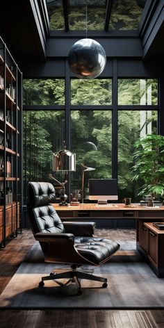 an office with large windows and a leather chair in front of a desk that is surrounded by bookshelves