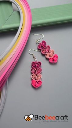 the earrings are made out of rolled paper