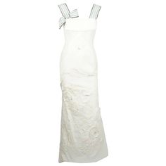 Carolina Herrera Ivory Cotton/Linen and Silk Applique Gown - 6 This breathtaking gown is made of an Ivory Cotton Linen Gown has extraordinary silk applique and beaded/pearl/rhinestone detail throughout the gown. It also has some embroidery throughout. The straps are made of a thick 2 inch grosgrain ribbon in Brown/Grey/Blue Stripes. The back of the dress have inverted box pleats forming a slight train. This gown is in excellent condition as it was only worn once. The gown has built in boning and Luxury White Silk Gown, White Silk Embellished Evening Dress, White Silk Evening Dress With Fitted Bodice, White Silk Evening Dress For Gala, White Silk Gown For Evening, Linen Gown, Carolina Herrera Dresses, White Ball Gowns, Beaded Evening Gowns