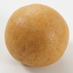 an orange on a white background with no one around it or in the foreground