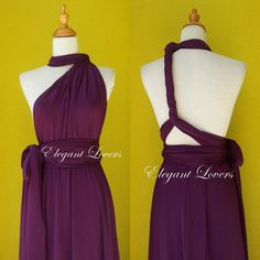 the dress is purple and has a halter style top with a tie at the waist