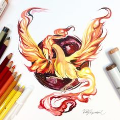 a drawing of a bird with flames on it's body and wings, surrounded by crayons