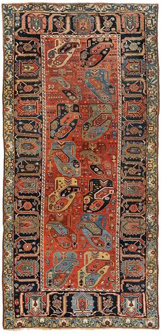 an antique persian rug with various colors and patterns