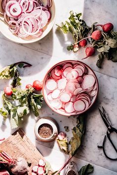 the table is full of fresh vegetables and other things to make it look like they have been cut up