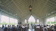 people are sitting at pews in a church