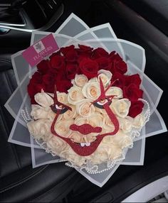 a bouquet of roses in the shape of a man's face