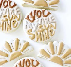 four decorated cookies with the words you are my sunshine and you are mine on them