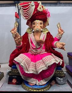 an elephant statue sitting on top of a table