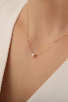 14K Solid Gold Dainty Pearl Necklace / Minimalist Pearl Necklace /Handmade Pearl Jewelry / Gift for Her / Mothers Day Gift / anniversary gift / birthday gift / chocker necklace   * Gold KT: 14K Solid Gold * Gold Color: 14K Gold * The length of the chain in the photo is 17 inches. * The pearl used in the necklace is a real cultured pearl. Follow on Instagram - @bayargold.tr My Web Site - https://www.bayargold.com/ * Bayar Gold is a fine jewelry company. Please do not hesitate to ask us questions. We are always here to help you. * All items are packed in the high-quality jewelry box. The gift message is available. Please let us know what to write by leaving us a note at checkout.  * Gift wrapping available.  Express shipping * United States: 4-6 business days * Canada: 4-6 business days * Eu Gold Necklace Pearl, Delicate Everyday Necklaces With Simple Design, Delicate Simple Necklaces For Everyday, Delicate Tiny Everyday Necklaces, Handmade Delicate Charm Necklace For Everyday, Everyday Delicate Necklaces, Minimalist White Pendant Birthstone Necklace, Minimalist Everyday Pearl Pendant Jewelry, Minimalist Tiny Necklace For Everyday