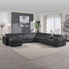 a modern living room with grey leather furniture