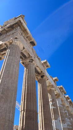 two large columns are shown against the blue sky