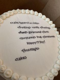 a cake with white frosting and writing on it