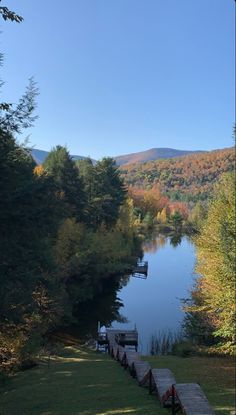 a lake surrounded by trees in the fall