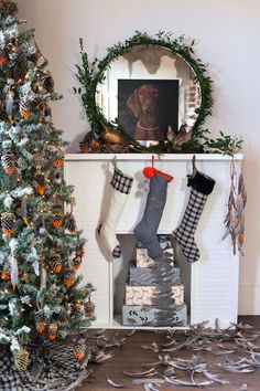 a fireplace with stockings hanging from the mantel