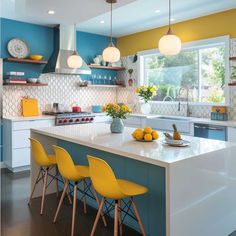 a kitchen with yellow chairs and blue cabinets in the center, along with white countertops