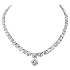 Haute-joaillerie diamond necklace riviera style with a diamond pendant. The necklace is comprising of 67 graduated round-cut diamonds, mounted in platinum. 16 diamonds are GIA certified weighing from 0.73 carats to 3 carats. The colors are from D to F, clarity from IF to SI1. The center diamond in the necklace is 3 carats, F VVS2. A copy of the GIA report is attached to the pictures. Pendant is a 6.54 carat round diamond F VVS1. Certified by GIA. Total weight of diamonds in the necklace is 44.72 carats. Total weight of diamonds including pendant is 51.26 carats. Metal is platinum; gross weight 60 grams. Length of the necklace without the pendant is 15 1/4 inches. The copies of all the GIA reports will be provided upon request. 1stdibs Diamond Necklace, Luxury Gia Certified Collectible Jewelry, Luxury Refined Diamond Necklace With Prong Setting, Luxury Platinum Diamond Pendant Necklace, Luxury White Gold Necklace With Gemstone, Luxury Dazzling Diamond Necklace With Prong Setting, Luxury Fine Jewelry Three Stone Necklace, Luxury Diamond Necklace With Pave Setting, Luxury Round Diamond Necklace With Filigree