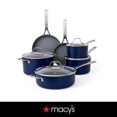 blue pots and pans are on display with the words macy's above them