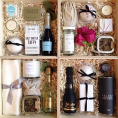 an open gift box filled with wine, candles and other items