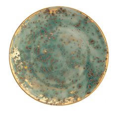 a green and gold plate with speckles on the rim, against a white background