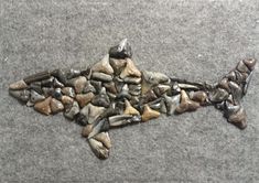 a piece of art made out of rocks and gravel