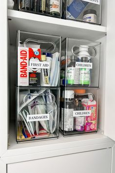 two clear bins filled with medical supplies on top of a white shelf in a closet