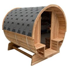 a wooden barrel shaped sauna with two benches