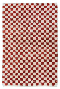 a red and white checkered rug with squares on it's sides, in the middle