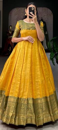 Yellow color Gown in Kanjeevaram Silk fabric with Weaving, Zari work Handloom Dress For Wedding And Eid, Handloom Fitted Wedding Dresses, Elegant Gold Dresses With Self Design, Chanderi Handloom Wedding Dress, Anarkali Dresses With Pallu In Tissue Silk, Anarkali Tissue Silk Dress With Pallu, Wedding Chanderi Handloom Dresses, Handloom Chanderi Wedding Dress, Full-length Gown With Pallu For Diwali