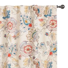 an embroidered curtain with flowers and leaves on it