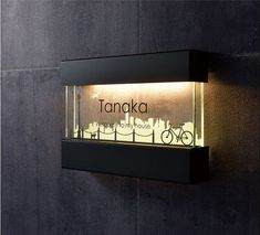 there is a sign on the wall that says tanka with a bike in it