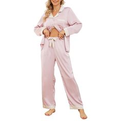 PRICES MAY VARY. ❤Luxurious Fabric: The women's silk pajama set is crafted from silky, wrinkle-resistant fabric. This long-sleeved sleepwear is lightweight and breathable, with excellent color fastness. Its high gloss adds an elegant element, suitable for all seasons. ❤Elegant Collar and Stylish Contrasting Accents: The top boasts a classic collar design and meticulous neckline construction, complemented by appropriately sized decorative chest pockets for carrying small items. The contrasting accents on the collar, cuffs, and hem, infuse the overall style with liveliness. The glossy buttoned front adds fashion and convenience. ❤Versatile and Relaxed Fit: Featuring a basic, comfortably loose-fit design with a flat hem, the women's satin pj set is ideal for various occasions. Whether you're Long Sleeve Pjs, Pjs Set, Satin Pj Set, Satin Pajama Set, Silk Pajamas Women, Pajamas For Women, Silk Pajama, Satin Pajama, Silk Pajama Set