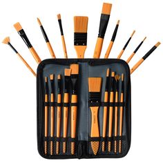 an orange and black case filled with lots of brushes