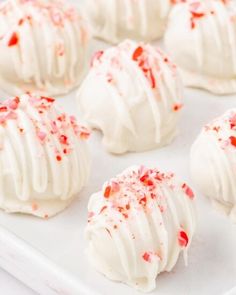 white chocolate covered with red sprinkles on a tray