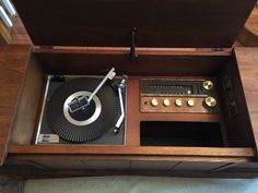 an old fashioned record player in a wooden box