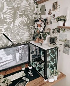 a desktop computer sitting on top of a wooden desk next to a monitor and keyboard