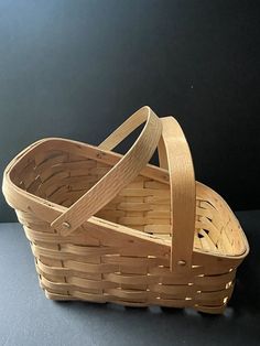 a wooden basket sitting on top of a table