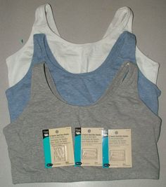 two women's sports bras with tags attached to the front and back of them