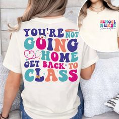 a woman wearing a t - shirt that says you're not going home get back to class