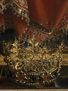 a close up of a gold and red cloth