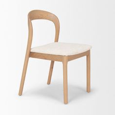 a wooden chair with a white cushion on the seat and backrest, against a white background