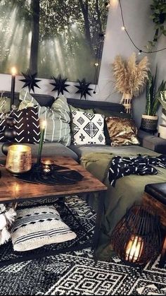 a living room filled with lots of furniture and decor on top of carpeted flooring