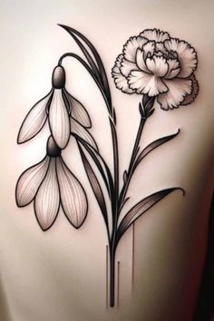 the back of a woman's stomach with flowers and leaves tattooed on her side