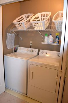 a washer and dryer sitting next to each other in a laundry room