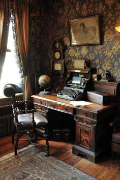 an old fashioned desk with a typewriter on it