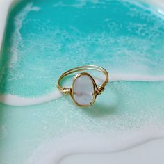 Pink or blue sea glass hand-wrapped in gold or silver wire. Sea glass shape and size vary. Sea Glass Rings, Dainty Chain Necklace, Sea Glass Ring, Beachglass Jewelry, Blue Sea Glass, Glass Ring, Pink Or Blue, Gem Ring, Wire Rings