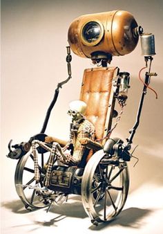 a robot sitting on top of a wheel chair with a camera attached to it's back