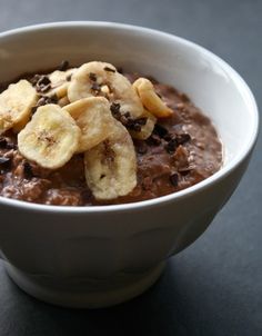 a bowl of oatmeal with bananas and chocolate chips